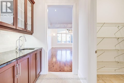 A hallway with a Royal LePage sign on the wall.