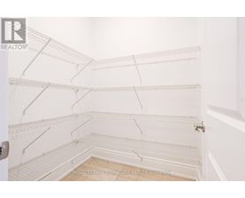 Empty white shelves in a room.