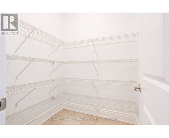 Empty white shelves in a room.