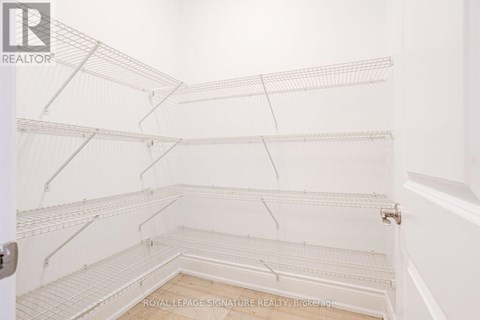 Empty white shelves in a room.