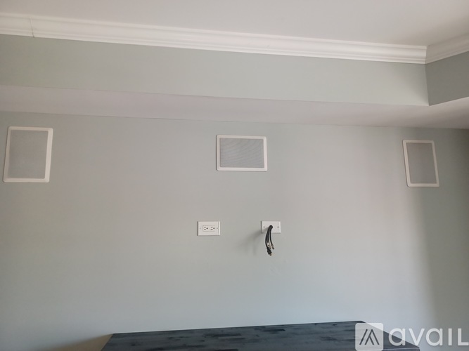 A wall with two switches and a socket.