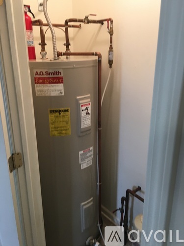 A.O. Smith tank with pipes and valves.