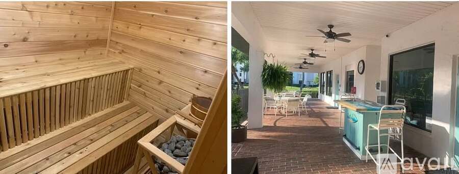 A wooden sauna and a patio with a hot tub.