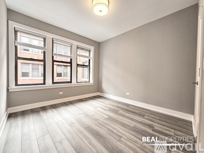 A room with a window and a door.