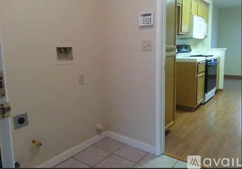 A kitchen area with a refrigerator, oven, and microwave.