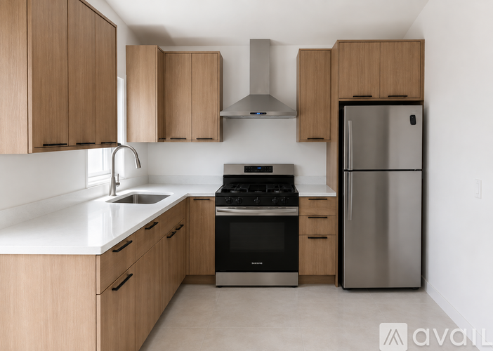 A kitchen with wooden cabinets and stainless steel appliances.