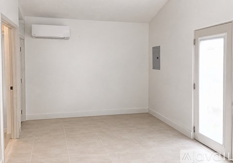 A room with a tiled floor and a sliding door.