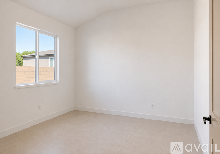 A room with a window and a door.