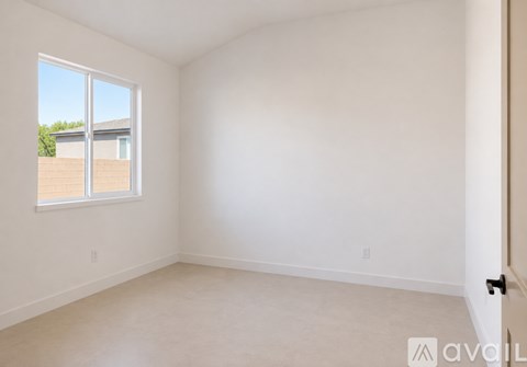 A room with a window and a door.