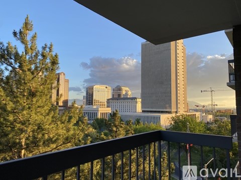 A cityscape with tall buildings and a clear sky.