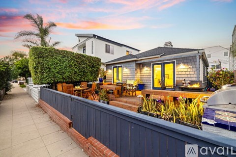 A house with a patio and a pool is available for rent.