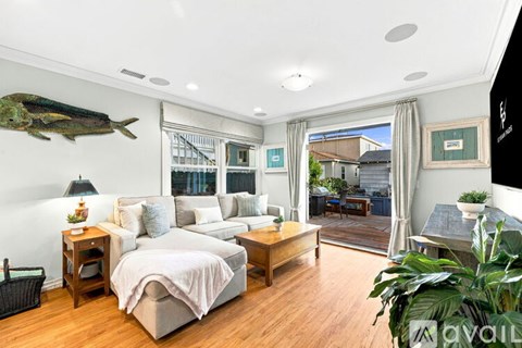 A bedroom with a large bed and a fish mounted on the wall.