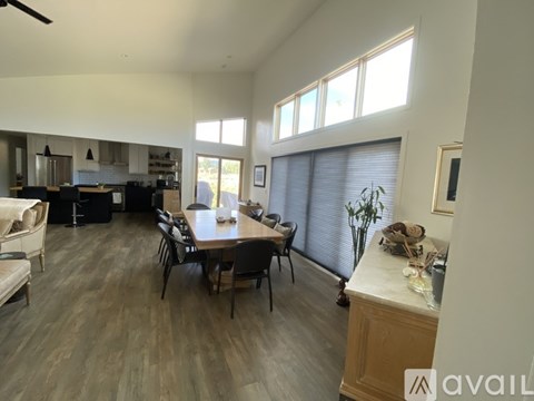A dining room with a table and chairs is shown.