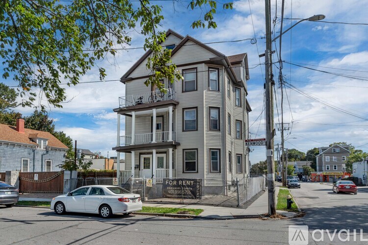 A two-story building with a balcony is for rent.