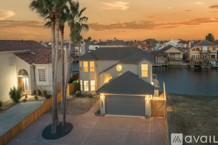 A house with a palm tree in front of it is available for sale.
