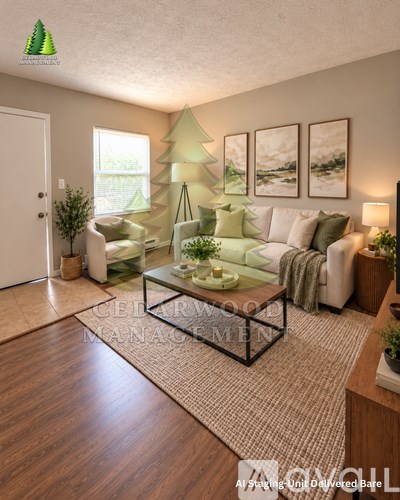 A living room with a Christmas tree and a couch.