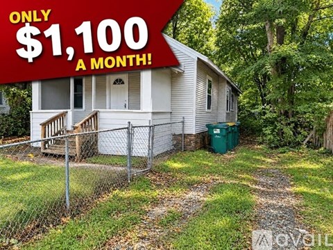 A house with a red sign that says $1,100 a month.