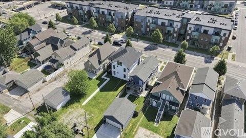 A bird's eye view of a residential area with houses and apartment buildings.