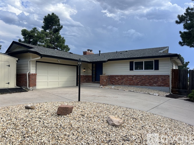 A house with a garage and a driveway.