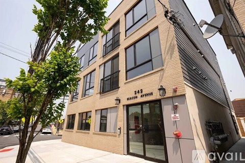 A building with the number 242 on it is located on 242 Broadway Avenue.