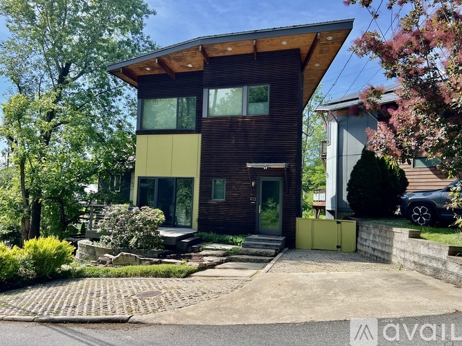 A modern house with a combination of wood and glass materials.