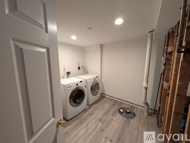 A laundry room with a washer and dryer.