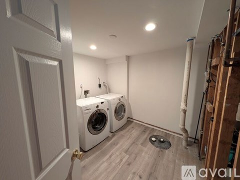 A laundry room with a washer and dryer.