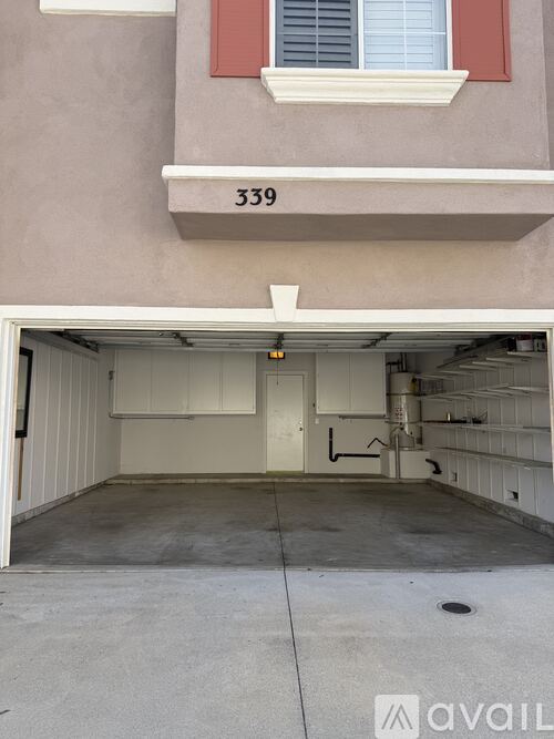 A garage with the number 339 on the wall above it.