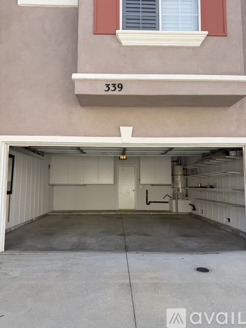 A garage with the number 339 on the wall above it.