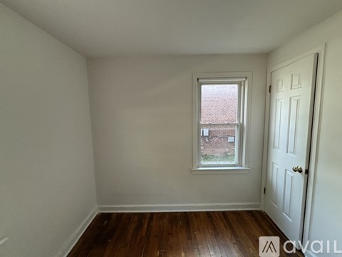 A room with a window and a door.