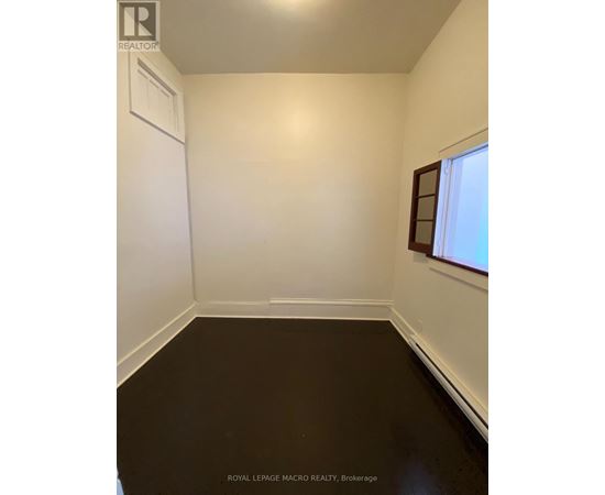 A white room with a window and a door.