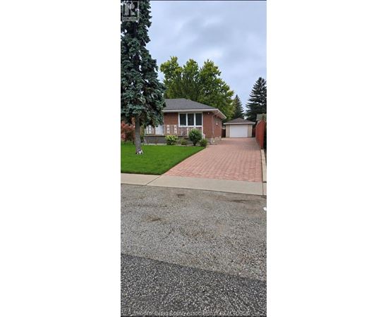 A house with a driveway in front of it.