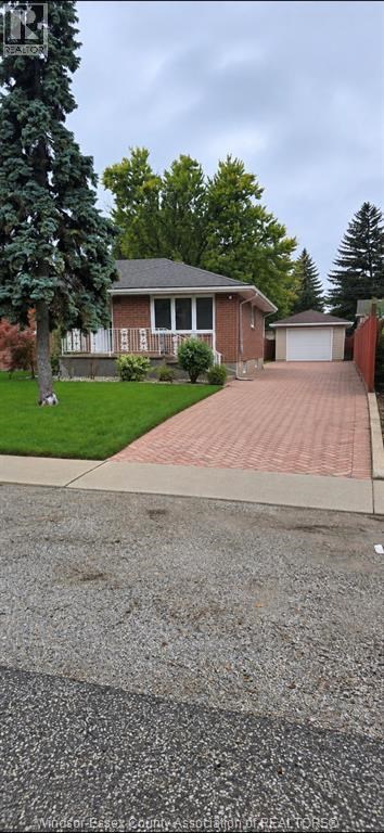 A house with a driveway in front of it.