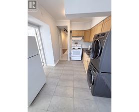 A laundry room with a washer and dryer.