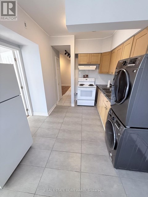 A laundry room with a washer and dryer.