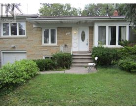 A house with a white door and a small front yard.