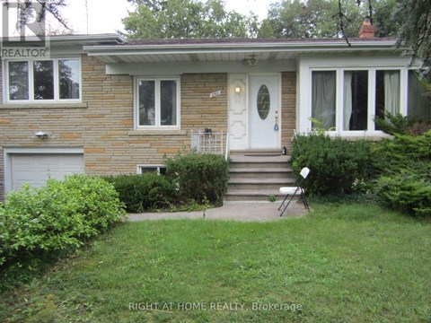 A house with a white door and a small front yard.