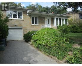 A house with a garage and a driveway.