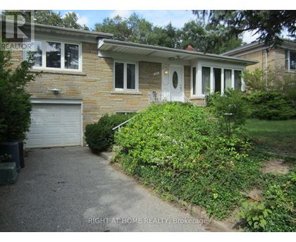 A house with a garage and a driveway.