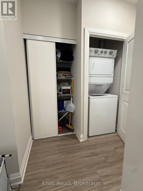 A white oven and dishwasher are installed in a kitchen.