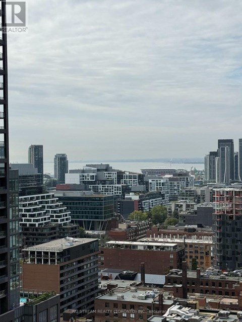 A cityscape with buildings of various heights and architectural styles.