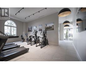 A gym with treadmills and exercise bikes.