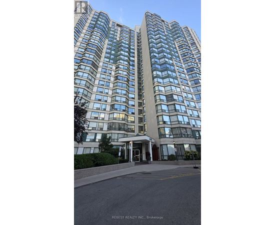 A tall building with many windows is shown in the image.