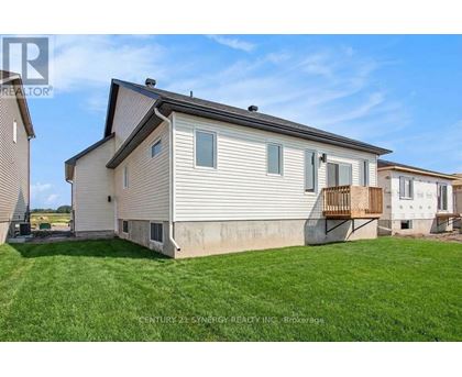 A house with a lawn in front of it is for sale.