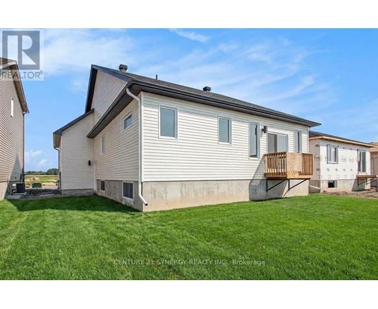 A house with a lawn in front of it is for sale.