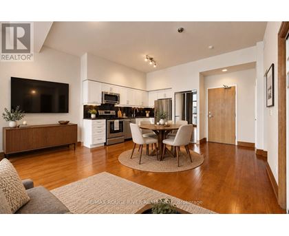 A modern kitchen with a dining table set in the middle.