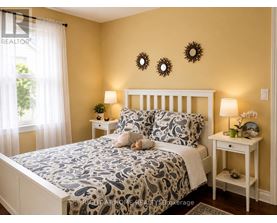 A bedroom with a bed, two lamps, and a nightstand.