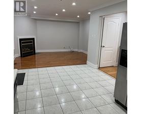 A room with a fireplace and a door.