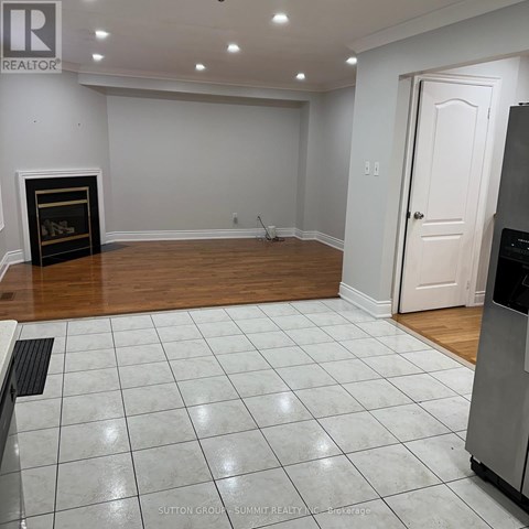 A room with a fireplace and a door.
