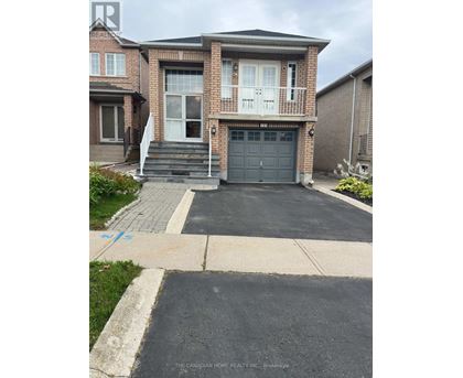 A house with a driveway in front of it.